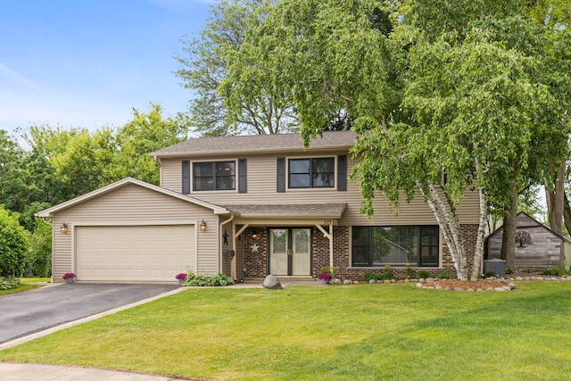 573 Surryse Rd, Lake Zurich, IL 60047 - view of front of house with driveway, an attached garage, a front yard, roof with shingles, and brick siding