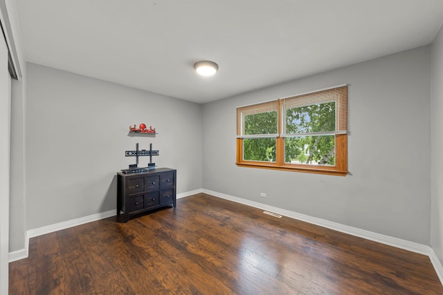 573 Surryse Rd, Lake Zurich, IL 60047 - unfurnished bedroom with dark wood-style floors and baseboards