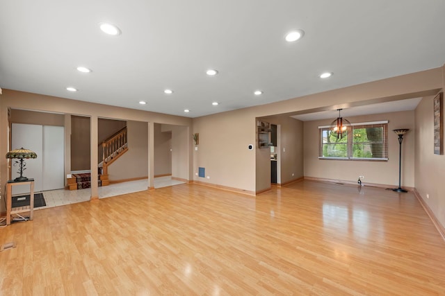 573 Surryse Rd, Lake Zurich, IL 60047 - unfurnished living room with light wood-type flooring, recessed lighting, and stairs