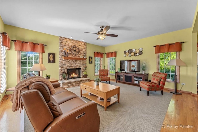 3720 Cypress Dr, Spring Grove, IL 60081 - living room featuring light wood-style flooring, ceiling fan, and a fireplace
