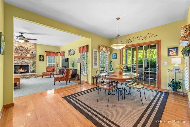 3720 Cypress Dr, Spring Grove, IL 60081 - dining room featuring ceiling fan, wood finished floors, and a fireplace