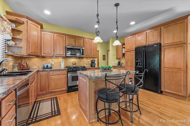 3720 Cypress Dr, Spring Grove, IL 60081 - kitchen with appliances with stainless steel finishes, open shelves, a center island, light wood-style flooring, and a breakfast bar