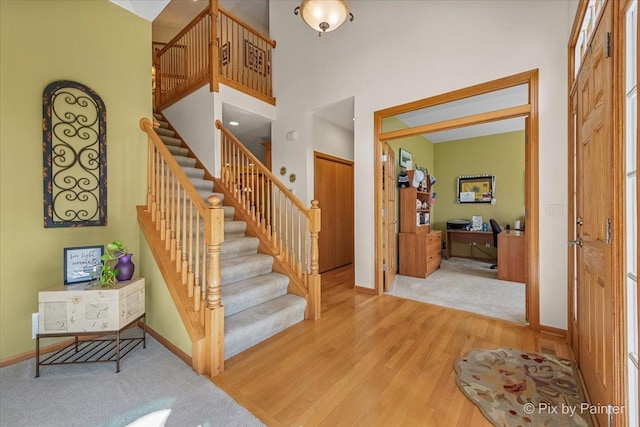 3720 Cypress Dr, Spring Grove, IL 60081 - stairs featuring wood finished floors and a high ceiling