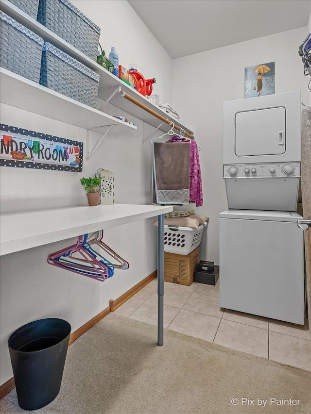 3720 Cypress Dr, Spring Grove, IL 60081 - washroom featuring estacked washer and dryer, light carpet, and light tile patterned floors