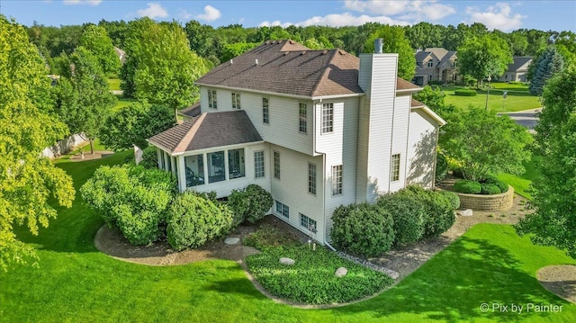 3720 Cypress Dr, Spring Grove, IL 60081 - rear view of property with a chimney and a lawn
