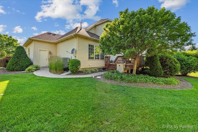 3720 Cypress Dr, Spring Grove, IL 60081 - back of property featuring a wooden deck, a lawn, and a shingled roof