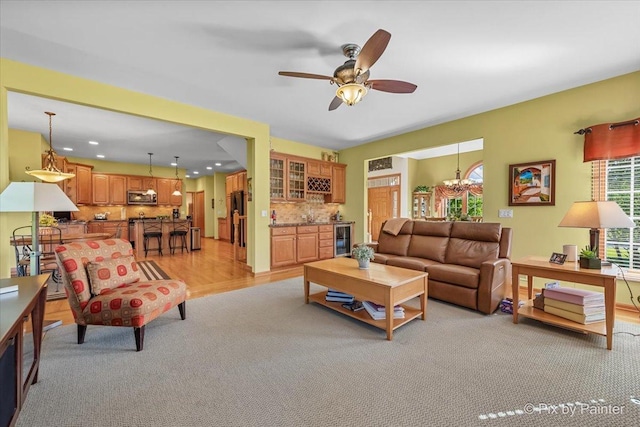 3720 Cypress Dr, Spring Grove, IL 60081 - living room with beverage cooler, bar, light colored carpet, ceiling fan, and recessed lighting