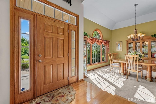 3720 Cypress Dr, Spring Grove, IL 60081 - entrance foyer featuring a chandelier, light wood-type flooring, and vaulted ceiling