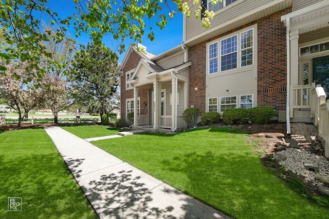 2673 N Greenwood Ave, Arlington Heights, IL 60004 - view of front of house featuring brick siding and a front yard