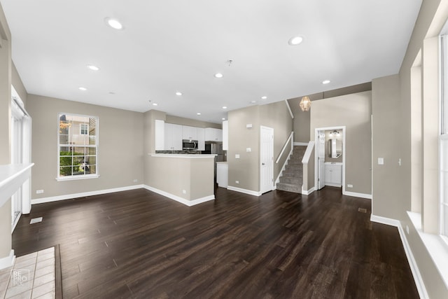2673 N Greenwood Ave, Arlington Heights, IL 60004 - unfurnished living room with dark wood finished floors, stairs, and recessed lighting