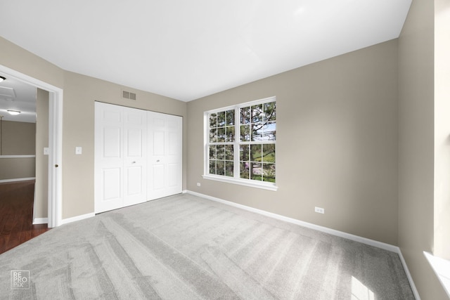 2673 N Greenwood Ave, Arlington Heights, IL 60004 - unfurnished bedroom with carpet floors and a closet