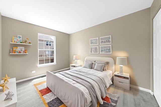 2673 N Greenwood Ave, Arlington Heights, IL 60004 - bedroom with baseboards and light wood-style flooring