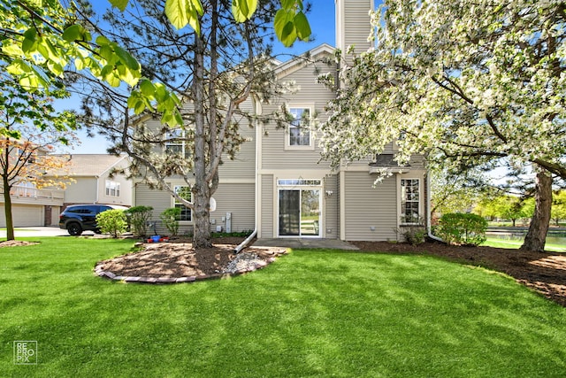 2673 N Greenwood Ave, Arlington Heights, IL 60004 - back of house with a yard and a chimney