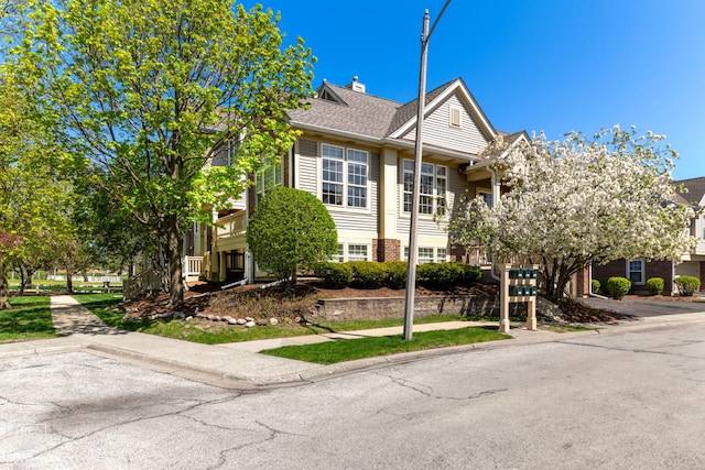 2673 N Greenwood Ave, Arlington Heights, IL 60004 - view of property featuring a chimney and a shingled roof