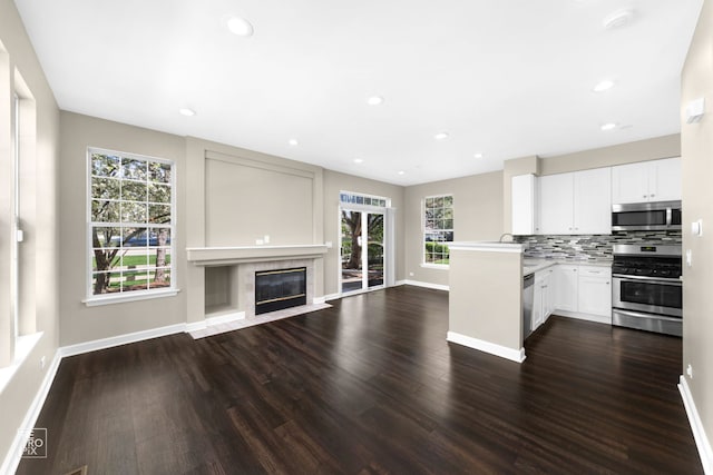 2673 N Greenwood Ave, Arlington Heights, IL 60004 - kitchen with stainless steel appliances, open floor plan, plenty of natural light, backsplash, and recessed lighting