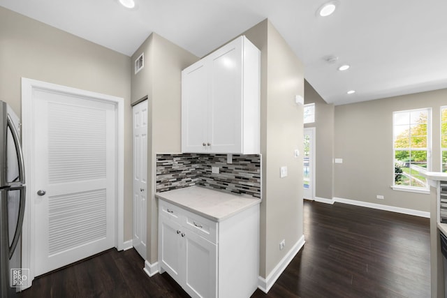 2673 N Greenwood Ave, Arlington Heights, IL 60004 - kitchen with freestanding refrigerator, tasteful backsplash, dark wood-style flooring, white cabinetry, and recessed lighting