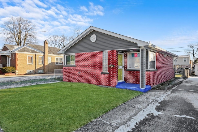 12629 S Throop St, Calumet Park, IL 60827 - view of front facade with brick siding and a front yard
