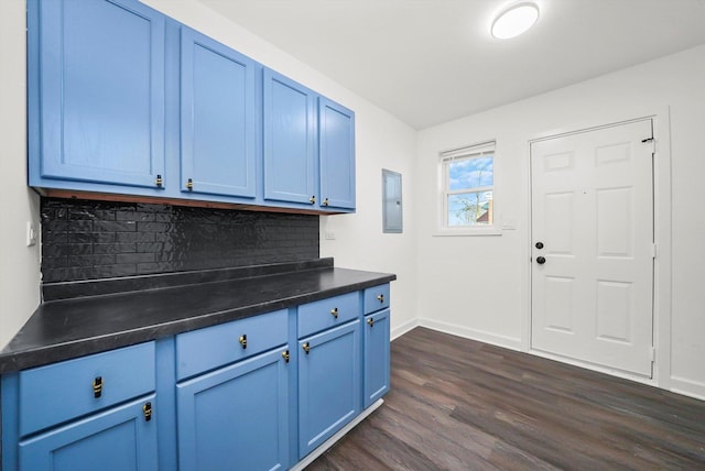 12629 S Throop St, Calumet Park, IL 60827 - kitchen featuring blue cabinetry, electric panel, dark countertops, dark wood-type flooring, and decorative backsplash