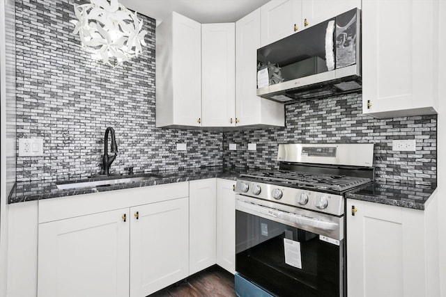 12629 S Throop St, Calumet Park, IL 60827 - kitchen featuring stainless steel appliances, tasteful backsplash, white cabinets, and dark stone countertops