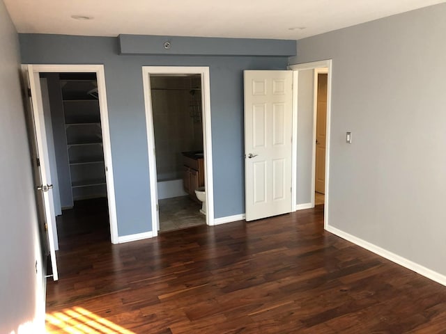 1919 S Wolf Rd Unit 418, Hillside, IL 60162 - unfurnished bedroom with dark wood-type flooring, a spacious closet, and ensuite bathroom