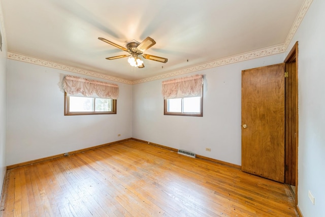 184 Kathleen Dr, Elgin, IL 60123 - unfurnished room featuring plenty of natural light, light wood-style flooring, ceiling fan, and ornamental molding