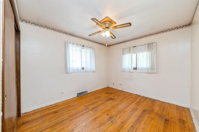 184 Kathleen Dr, Elgin, IL 60123 - unfurnished room featuring a ceiling fan and light wood-style floors