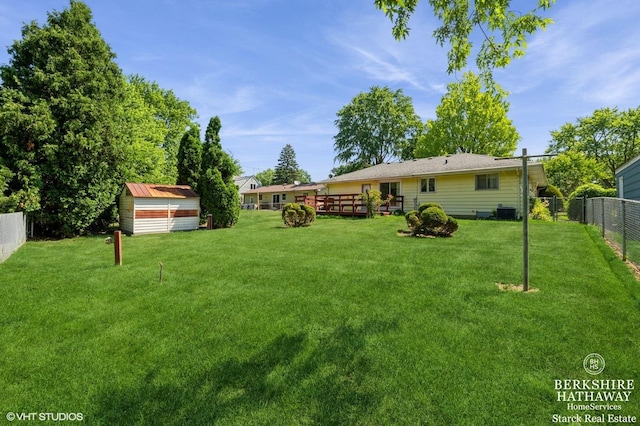 184 Kathleen Dr, Elgin, IL 60123 - fenced backyard featuring a storage unit