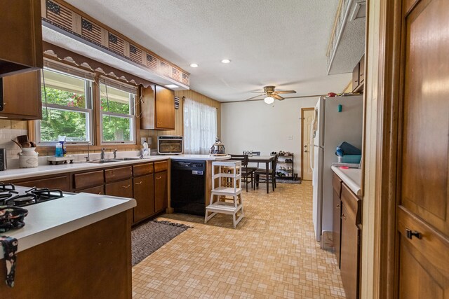 103 Taylor Ct, Catlin, IL 61817 - kitchen with dishwasher, light countertops, light flooring, ceiling fan, and recessed lighting