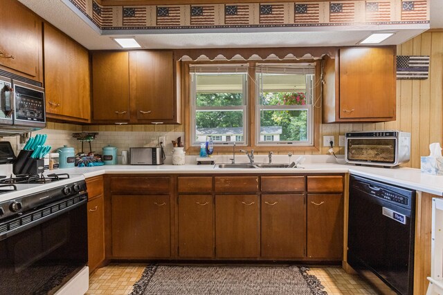 103 Taylor Ct, Catlin, IL 61817 - kitchen featuring black appliances, backsplash, light countertops, and brown cabinetry