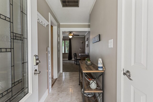 103 Taylor Ct, Catlin, IL 61817 - entryway featuring a ceiling fan, light tile patterned flooring, and ornamental molding