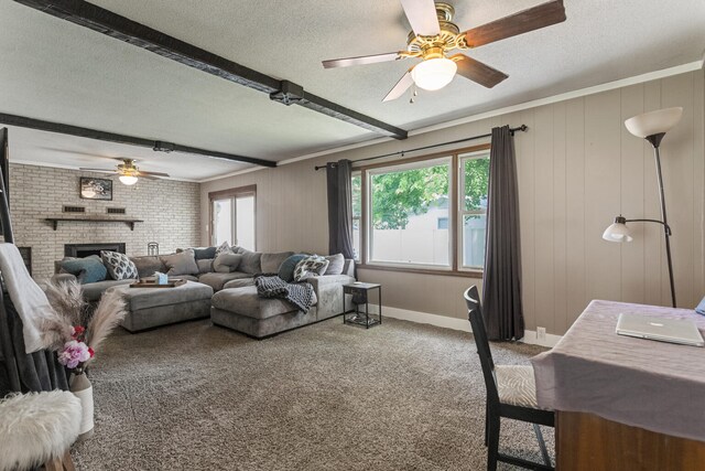 103 Taylor Ct, Catlin, IL 61817 - living room with a textured ceiling, a ceiling fan, carpet flooring, a fireplace, and beam ceiling