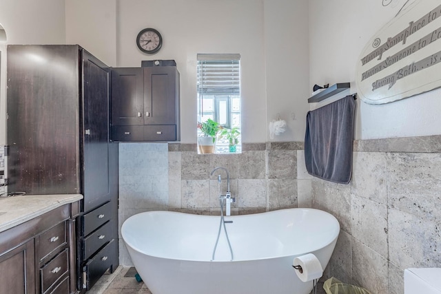 3605 W Cermak Rd, Chicago, IL 60623 - full bath with tile walls, a freestanding tub, and a wainscoted wall