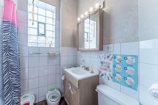 3605 W Cermak Rd, Chicago, IL 60623 - bathroom with tile walls, vanity, and curtained shower