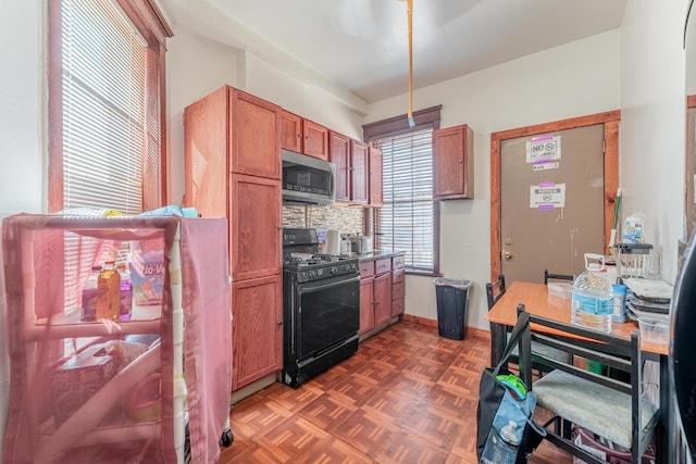3605 W Cermak Rd, Chicago, IL 60623 - kitchen with black gas range, stainless steel microwave, decorative backsplash, and brown cabinetry