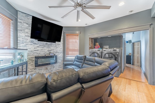 3605 W Cermak Rd, Chicago, IL 60623 - living area with ceiling fan, light wood-type flooring, separate washer and dryer, recessed lighting, and a stone fireplace