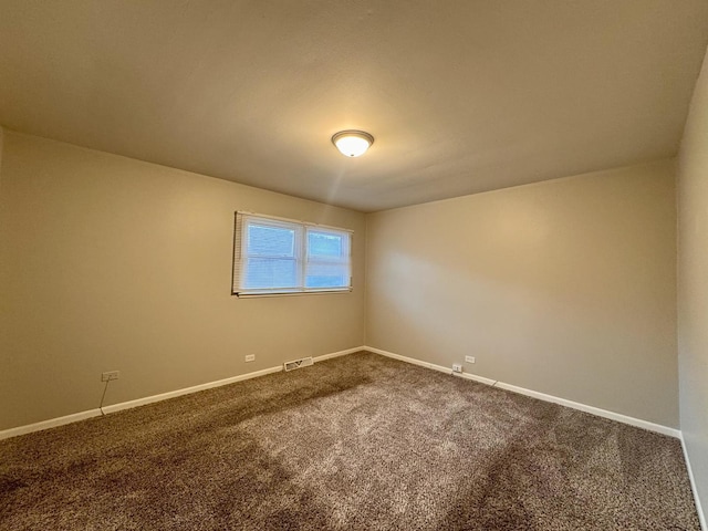 3732 153rd St, Midlothian, IL 60445 - empty room featuring dark carpet and baseboards