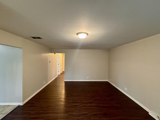 3732 153rd St, Midlothian, IL 60445 - spare room featuring dark wood-style floors and baseboards