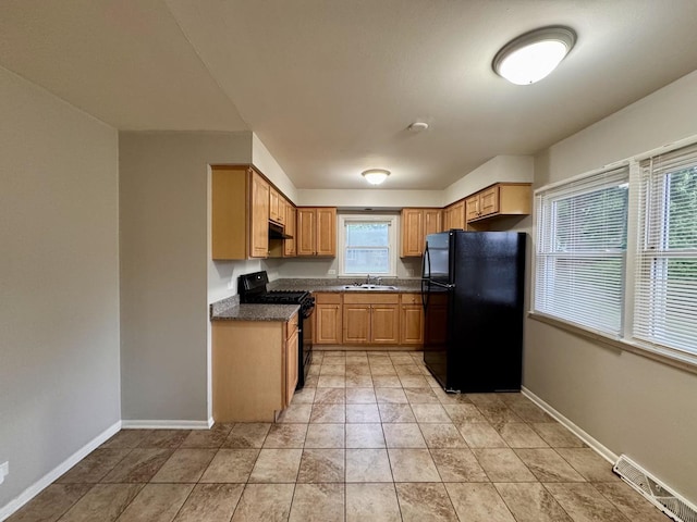 3732 153rd St, Midlothian, IL 60445 - kitchen featuring black appliances, dark countertops, and under cabinet range hood