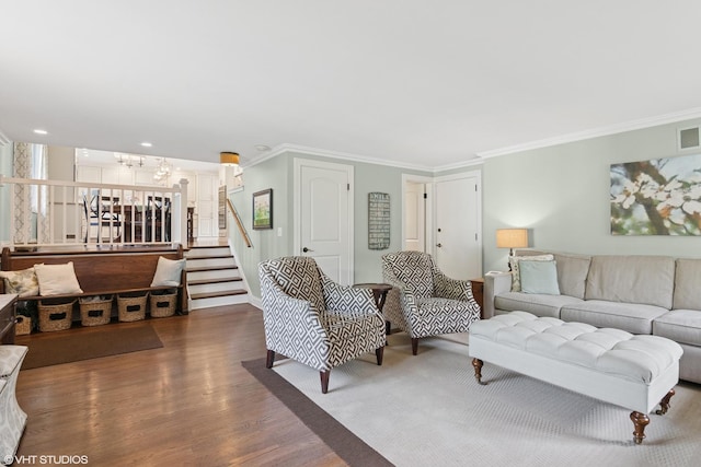769 S Stuart Ave, Elmhurst, IL 60126 - living room with wood finished floors, crown molding, a chandelier, and stairs