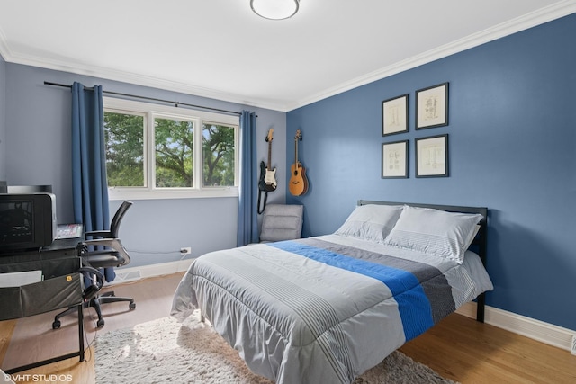 769 S Stuart Ave, Elmhurst, IL 60126 - bedroom featuring wood finished floors, ornamental molding, and a desk