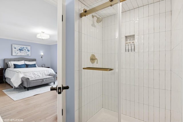 769 S Stuart Ave, Elmhurst, IL 60126 - ensuite bathroom featuring crown molding, a shower stall, and wood finished floors