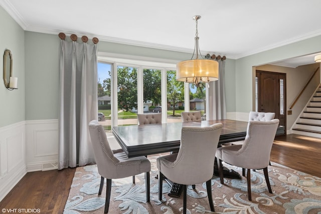 769 S Stuart Ave, Elmhurst, IL 60126 - dining space with dark wood-style floors, ornamental molding, stairway, a chandelier, and wainscoting