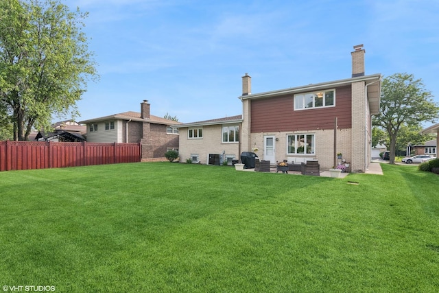769 S Stuart Ave, Elmhurst, IL 60126 - rear view of property with brick siding, a chimney, and a patio area