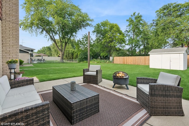 769 S Stuart Ave, Elmhurst, IL 60126 - fenced backyard with a storage shed, a patio area, and an outdoor living space with a fire pit