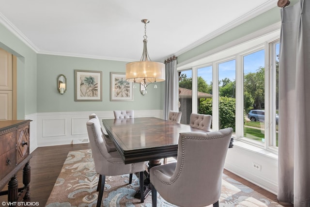 769 S Stuart Ave, Elmhurst, IL 60126 - dining area with healthy amount of natural light, ornamental molding, dark wood-type flooring, and a wainscoted wall