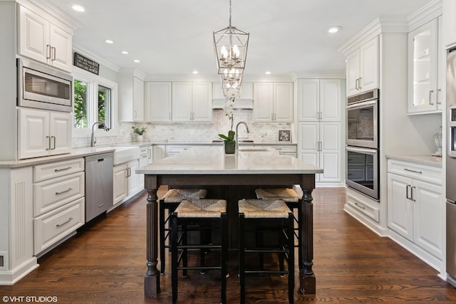 769 S Stuart Ave, Elmhurst, IL 60126 - kitchen featuring appliances with stainless steel finishes, white cabinets, tasteful backsplash, recessed lighting, and ornamental molding