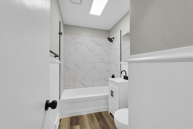 1211 Garden Ln, Champaign, IL 61820 - bathroom with  shower combination, wood finished floors, a wainscoted wall, and vanity