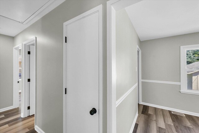 1211 Garden Ln, Champaign, IL 61820 - hallway featuring attic access and wood finished floors