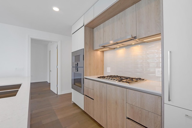 211 N Harbor Dr Unit 1601, Chicago, IL 60601 - kitchen with light brown cabinets, stainless steel appliances, modern cabinets, light countertops, and tasteful backsplash