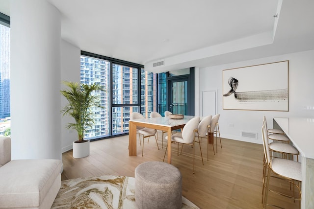211 N Harbor Dr Unit 1601, Chicago, IL 60601 - dining space featuring wood finished floors, floor to ceiling windows, and plenty of natural light